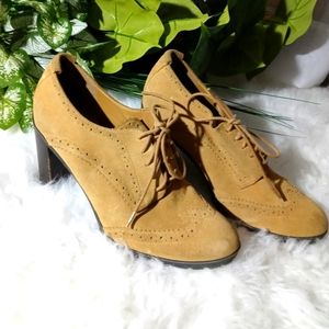 Tommy Hilfiger tie-up, wedged-heel shoes.